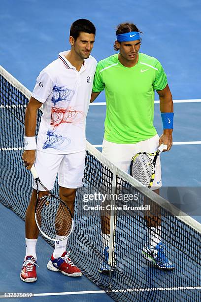 Novak Djokovic of Serbia and Rafael Nadal of Spain pose prior to their men's final match during day fourteen of the 2012 Australian Open at Melbourne...