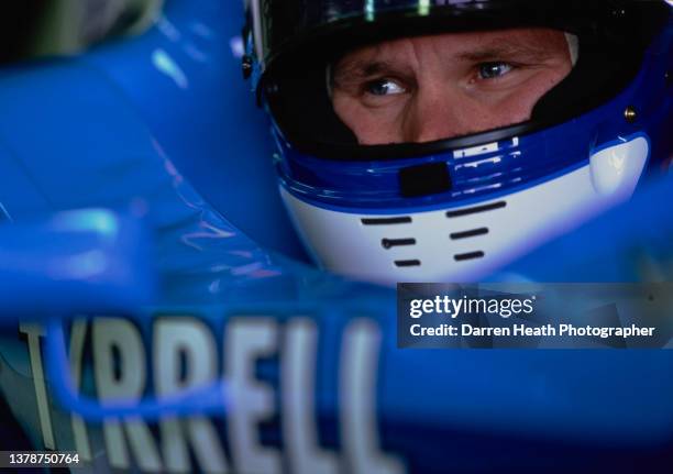 Mika Salo of Finland looks out from the cockpit of the Tyrrell Yamaha Tyrrell 024 Yamaha V10 during practice for the Formula One Grand Prix of Japan...