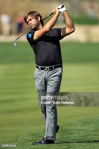 Robert Rock of England hits a shot from the fairway during the final round of the Abu Dhabi HSBC Golf Championship at the Abu Dhabi Golf Club on...