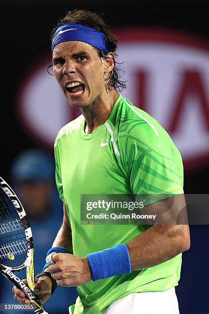 Rafael Nadal of Spain celebrates a point in his men's final match against Novak Djokovic of Serbia during day fourteen of the 2012 Australian Open at...