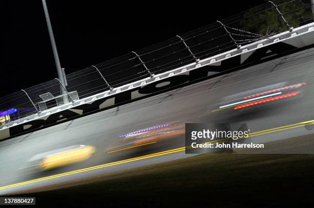 General veiw of cars racing under a sign during the Rolex 24 at Daytona International Speedway on January 29, 2012 in Daytona Beach, Florida.