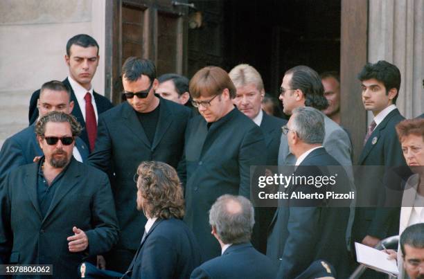 British singer Elton John and his partner David Furnish attends the final tribute to Italian fashion designer Gianni Versace at the Duomo di Milano....