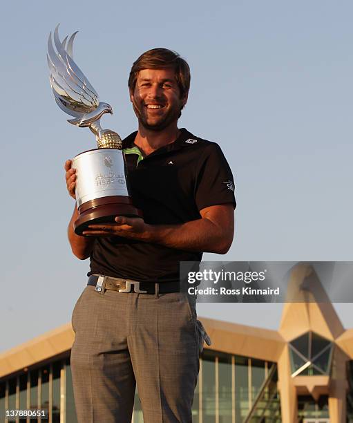 Robert Rock of England with the Champions trophy after winning the Abu Dhabi HSBC Golf Championship at the Abu Dhabi HSBC Golf Championship on...