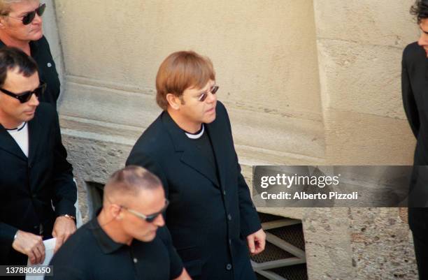 British singer Elton John attends the final tribute to Italian fashion designer Gianni Versace at the Duomo di Milano. | Location: Milan, Italy.