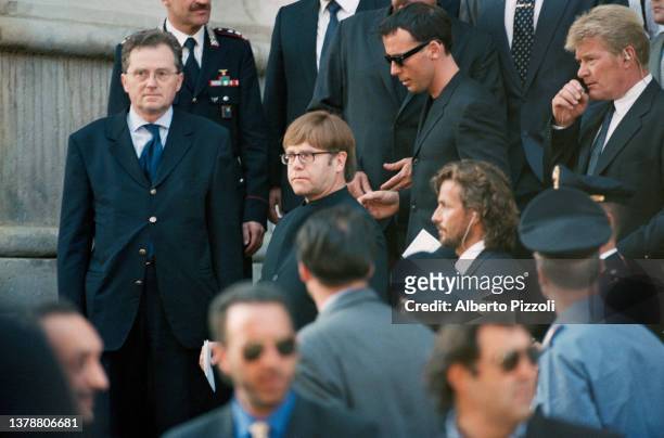 British singer Elton John and his partner David Furnish attends the final tribute to Italian fashion designer Gianni Versace at the Duomo di Milano....