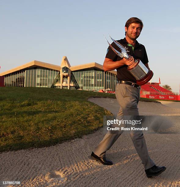 Robert Rock of England with the Champions trophy after winning the Abu Dhabi HSBC Golf Championship at the Abu Dhabi HSBC Golf Championship on...