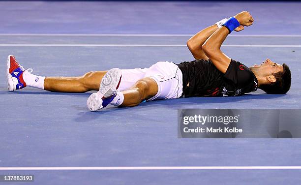 Novak Djokovic of Serbia celebrates winning championship point in his men's final match against Rafael Nadal of Spain during day fourteen of the 2012...