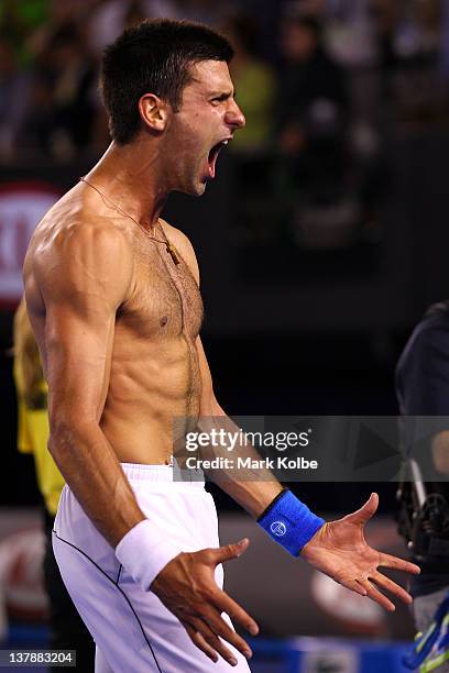 Novak Djokovic of Serbia celebrates winning championship point in his men's final match against Rafael Nadal of Spain during day fourteen of the 2012...