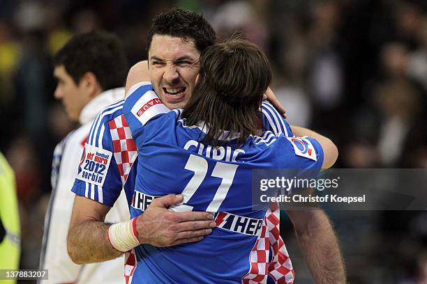 Blazenko Lackovic embraces Ivan Cupic of Croatia after the Men's European Handball Championship bronze medal match between Croatia and Spain at...