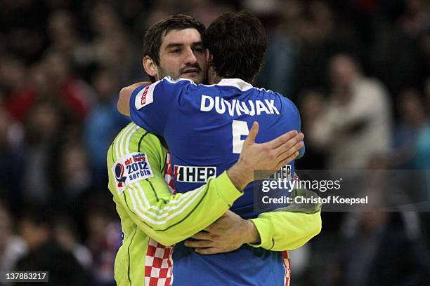 Mirko Allovic of Croatia embraces Domagoj Duvnjak Domagoj Duvnjak after winning the Men's European Handball Championship bronze medal match between...