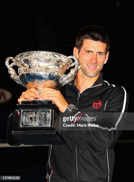 Novak Djokovic of Serbia poses with the Norman Brookes Challenge Cup after winning the men's final match against Rafael Nadal of Spain during day...