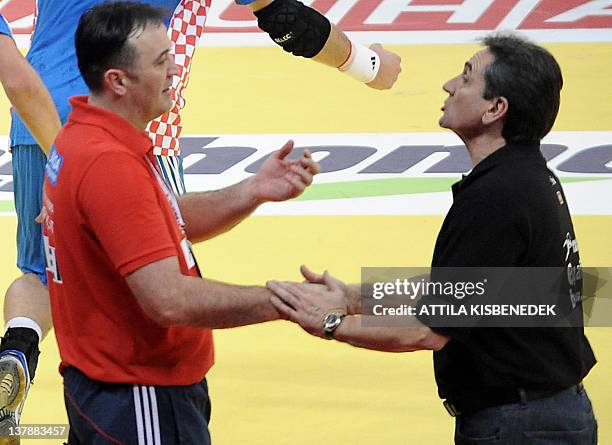 Croatia's head coach Slavko Goluza and Spain's head coach Valero Rivera shake hands after the men's EHF Euro 2012 Handball Championship bronze medal...