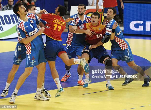 Spain's Daniel Sarmiento vies with Croatia's defence during the men's EHF Euro 2012 Handball Championship bronze medal match Croatia vs Spain on...