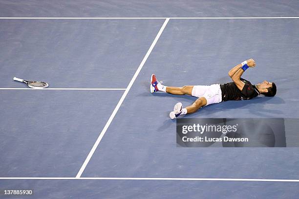 Novak Djokovic of Serbia celebrates winning championship point in his men's final match against Rafael Nadal of Spain during day fourteen of the 2012...