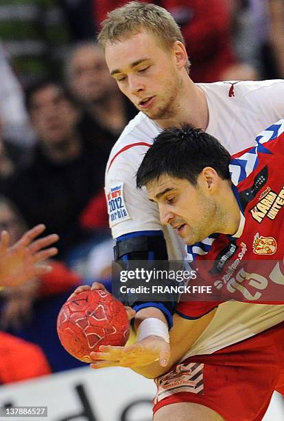 Serbia's Nenad Vuckovic vies with Denmark's René Toft Hansen during the men's EHF Euro 2012 Handball Championship final Serbia vs Denmark on January...