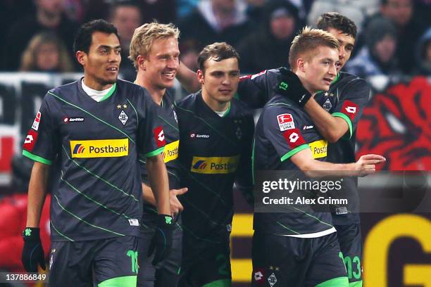 Mike Hanke of Moenchengladbach celebrates his team's first goal with team mates Juan Arango, Tony Jantschke, Marco Reus and Roman Neustaedter during...