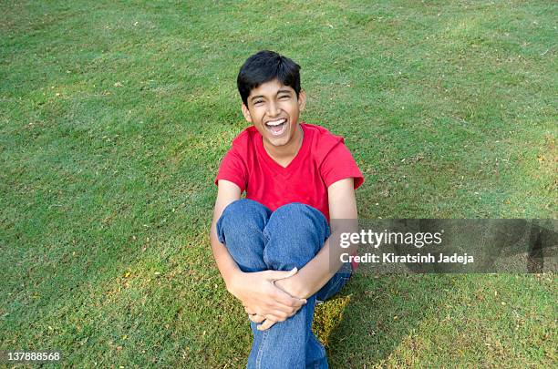 teenager laughing innocently - kiratsinh jadeja stock-fotos und bilder