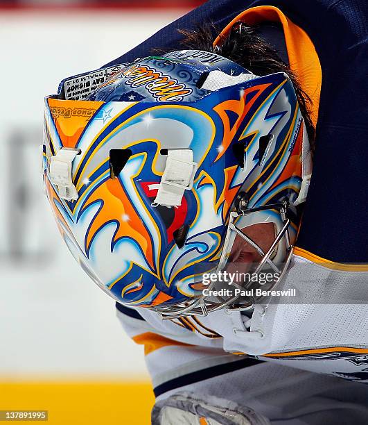 Goalie Ryan Miller of the Buffalo Sabres waits for a faceoff giving a good view of his mask and helmet during an NHL hockey game against the New...