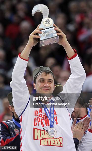 Momir Ilic of Serbia poses with the trophy for the second place on the podium after losing 19-21 the Men's European Handball Championship final match...