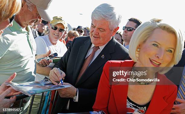 Republican presidential candidate and former Speaker of the House Newt Gingrich and his wife Callista Gingrich greets supporters and give autographs...