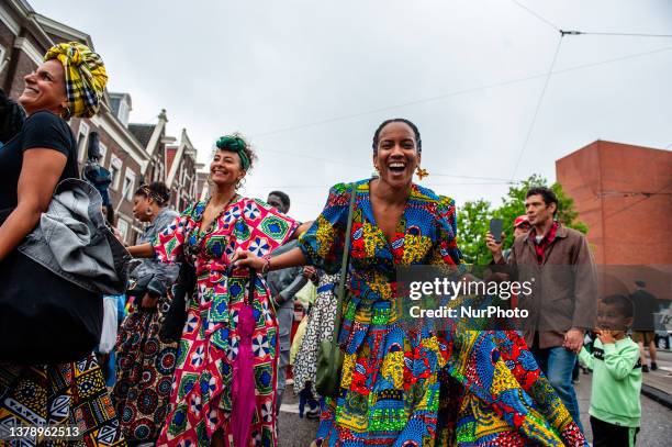 Surinamese people are seen celebrating the Keti Koti, which means 'Broken Chains' in Surinamese, and it's a free celebration of liberty, equality,...