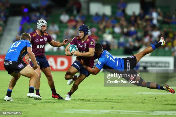Toni Pulu of the Force tackles Josh Flook of the Reds during the round three Super Rugby Pacific match between the Western Force and the Queensland...