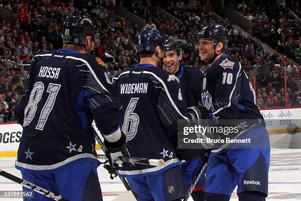 Marian Gaborik of the New York Rangers and Team Chara celebrates with his teammates after scoring a goal in the first period against Team Alfredsson...