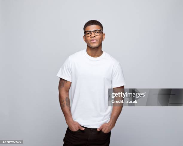 portrait of friendly young man - white t shirt studio stock pictures, royalty-free photos & images