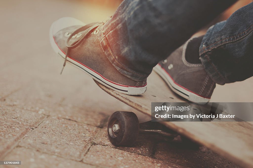 Feet captured on skateboard