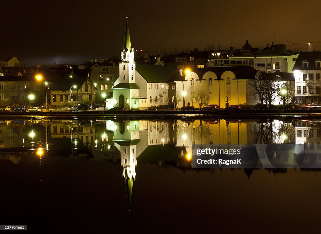 Houses reflection in pond