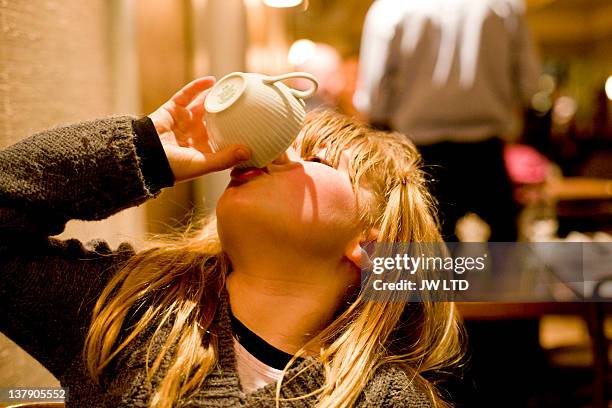 girl drinking from teacup - head back stock pictures, royalty-free photos & images