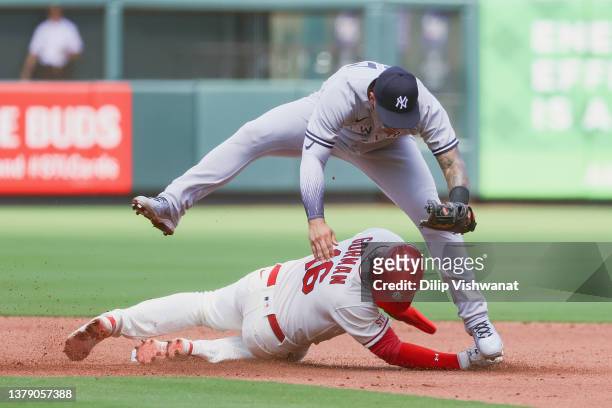 Nolan Gorman of the St. Louis Cardinals slides safely into second base against Gleyber Torres of the New York Yankees in the third inning of game one...