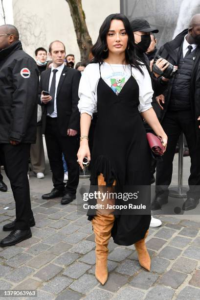 Amina Muaddi attends the Loewe Womenswear Fall/Winter 2022/2023 show as part of Paris Fashion Week on March 04, 2022 in Paris, France.