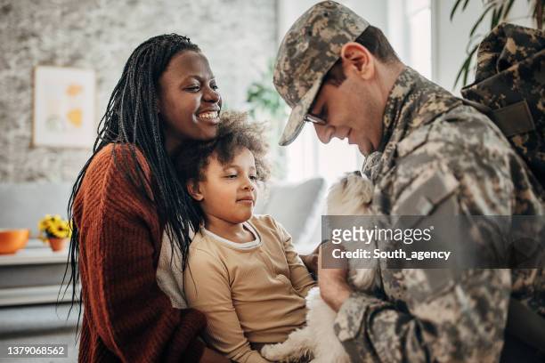 Military soldier coming home to his family after the war