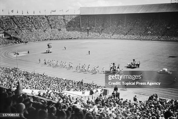 The start of the men's marathon at Wembley Stadium during the Olympic Games in London, 7th August 1948.