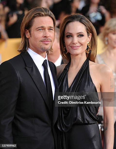 Actors Brad Pitt and Angelina Jolie attend The 18th Annual Screen Actors Guild Awards broadcast on TNT/TBS at The Shrine Auditorium on January 29,...