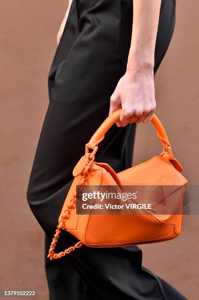 Model walks the runway during the Loewe Ready to Wear Fall/Winter 2022-2023 fashion show as part of the Paris Fashion Week on March 4, 2022 in Paris,...