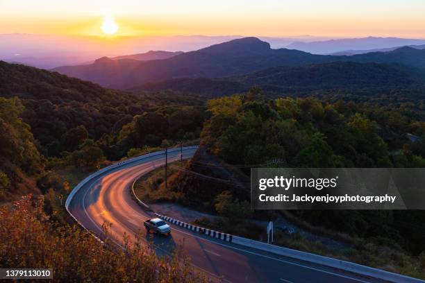 way on the mountain with sunrise time - mountain road - fotografias e filmes do acervo