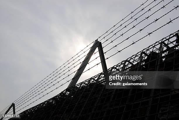 barbed wire fence - concentration camp stock pictures, royalty-free photos & images