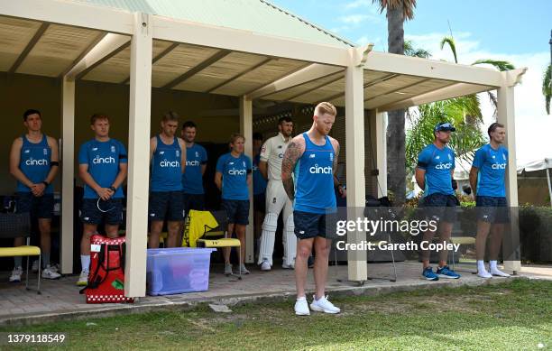 England players and staff stand for a moments silence in memory of Australian cricketer Shane Warne during day four of the tour match between West...