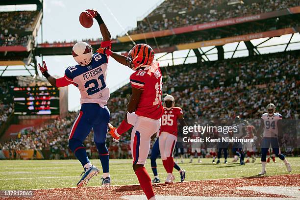 Patrick Peterson of the Arizona Cardinals intercepts a pass meant for A.J. Green of the Cincinnati Bengals during the 2012 NFL Pro Bowl between the...