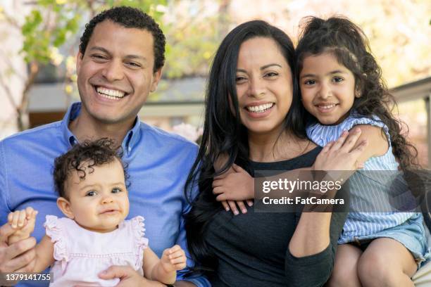 latin family portrait - fat woman sitting on man 個照片及圖片檔