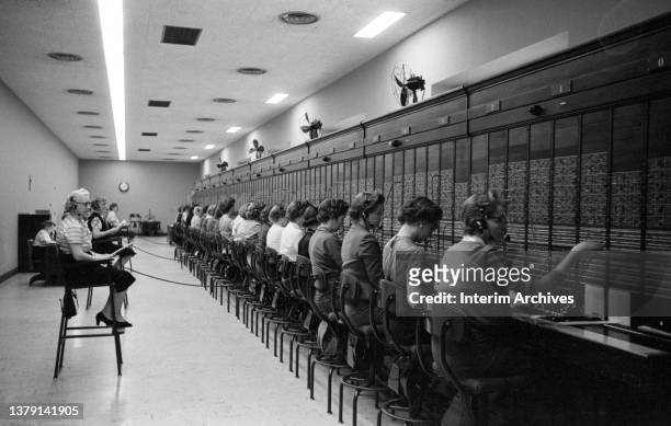View of a row of women working the telephone switchboard at the United States Capitol, Washington, DC, January 27, 1959.