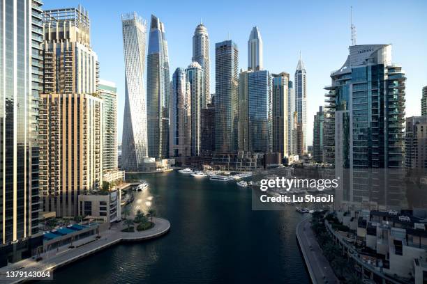 urban skyline and modern skyscrapers in dubai marina. - dubai stock-fotos und bilder