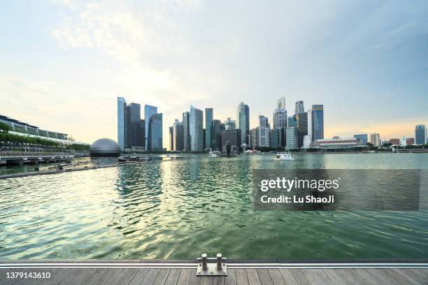 urban skyline and cityscape in marina bay singapore. - marina bay sands stock pictures, royalty-free photos & images