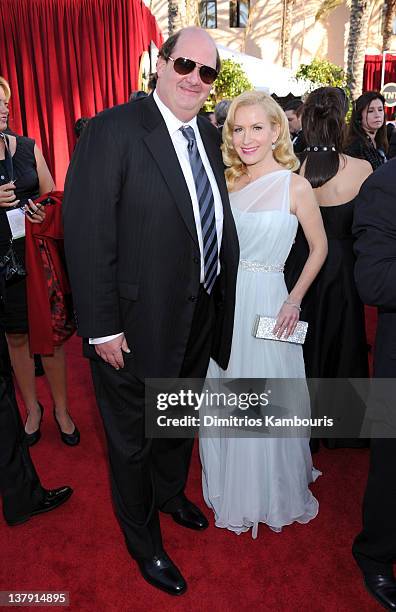 Actors Brian Baumgartner and Angela Kinsey attend The 18th Annual Screen Actors Guild Awards broadcast on TNT/TBS at The Shrine Auditorium on January...