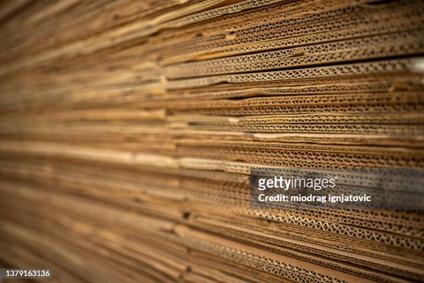 flattened cardboard boxes ready for recycling - paper industry stock pictures, royalty-free photos & images