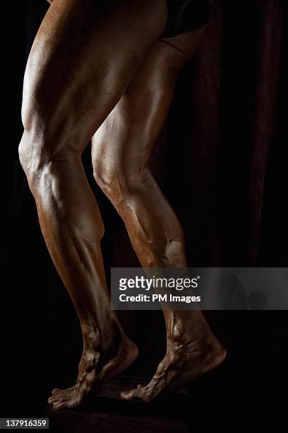 body builder's legs - human leg closeup stock pictures, royalty-free photos & images