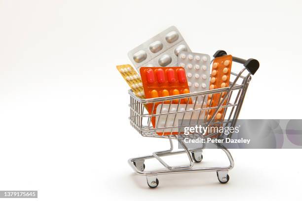 pills in supermarket trolley - codeine stockfoto's en -beelden