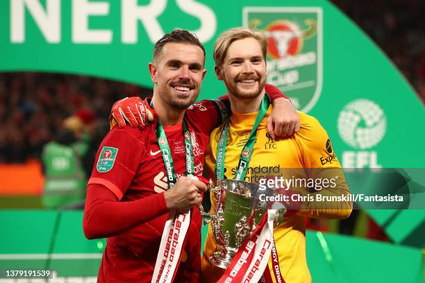 Jordan Henderson and Caoimhin Kelleher of Liverpool celebrate with the trophy following the Carabao Cup Final match between Chelsea and Liverpool at...
